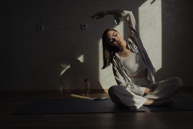 A person practicing yoga in a serene, sunlit room, demonstrating a calming pose. The image promotes relaxation and mindfulness as ways to manage anxiety.
