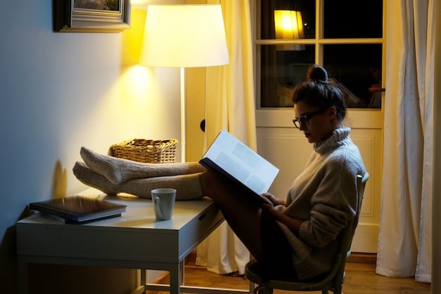 A brightly lit SAD therapy lamp sitting on a desk, with a person reading a book nearby, capturing the essence of light therapy as a method to combat Seasonal Affective Disorder.