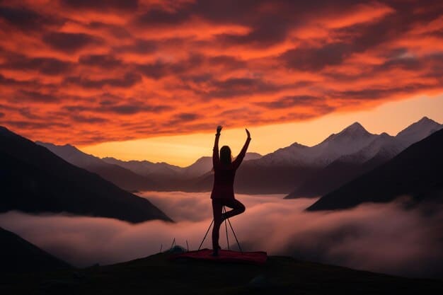 A person practicing yoga at sunrise in a serene mountain setting, emphasizing the connection between physical activity and mental calmness.