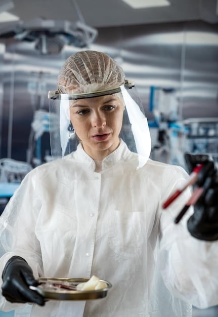 A lab technician using advanced equipment to test a food sample for pathogens. Focus on the scientific instruments and the technician's protective gear.