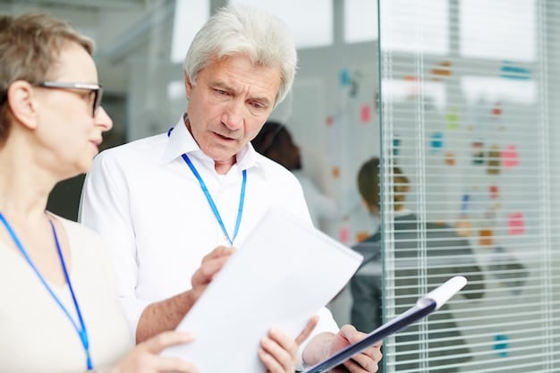 A geriatric doctor interacting with a senior patient in a clinic, reviewing medical records and discussing health concerns with a caring and attentive demeanor.