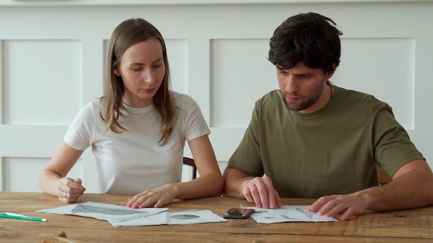 A close-up shot of a couple reviewing their tax return paperwork, highlighting the sections related to the Earned Income Tax Credit (EITC) with focused, thoughtful expressions.