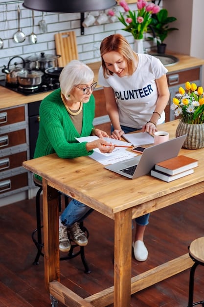 A supportive social worker sitting at a table across from an elderly woman and her daughter, reviewing documents together. The scene suggests collaboration and guidance.