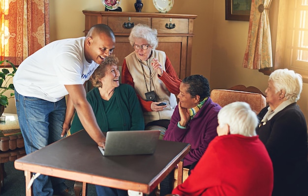 A diverse group of caregivers, including a younger man helping his grandmother and a woman assisting her sibling via video call, highlighting the expanded definition of 