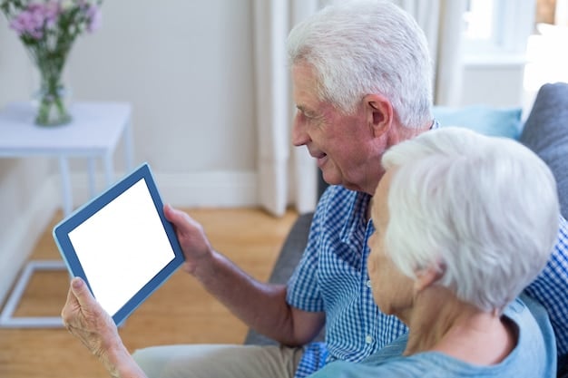 A close-up photo of a caregiver and an elderly person looking at a tablet together, smiling. The tablet displays the Elder Care Locator website, illustrating easy access to information and resources.