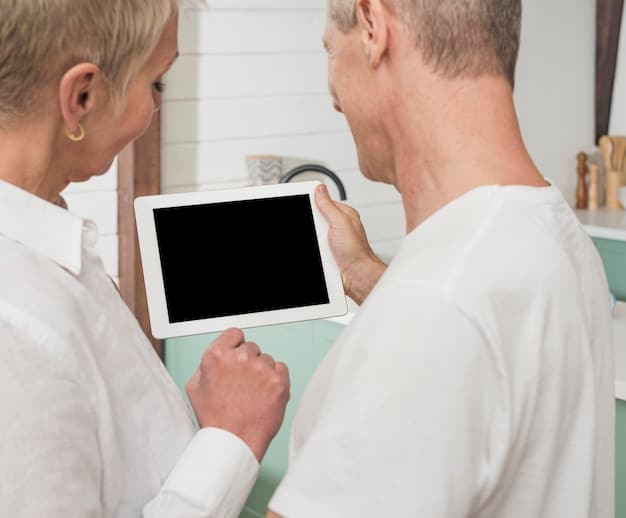 A caregiver and a senior looking at a tablet displaying the Medicare enrollment website, with a magnifying glass hovering over the screen.
