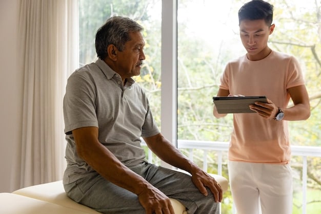 A caregiver is listening intently to an elderly man while taking notes, showing active listening and care.