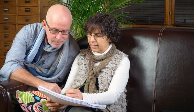 A caregiver and a senior are looking at a checklist together, discussing and planning their day with problem-solving in mind.