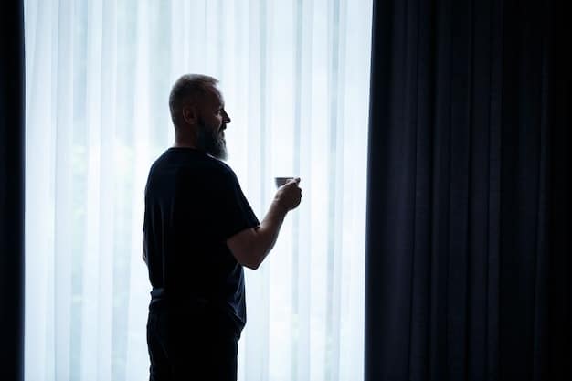 A silhouetted caregiver looking out a window at night, with a serene expression, conveying a moment of self-reflection and acceptance of limitations.