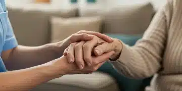 Caregiver's hands holding elderly person's hands, symbolizing support and connection